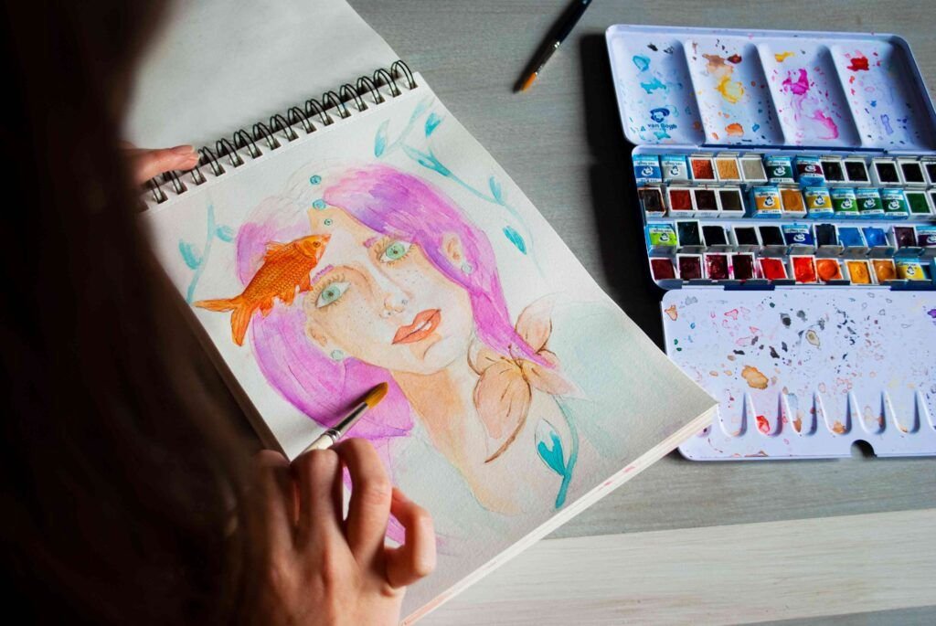 Diva ilustrada dibujando la acuarela de una mujer piscis